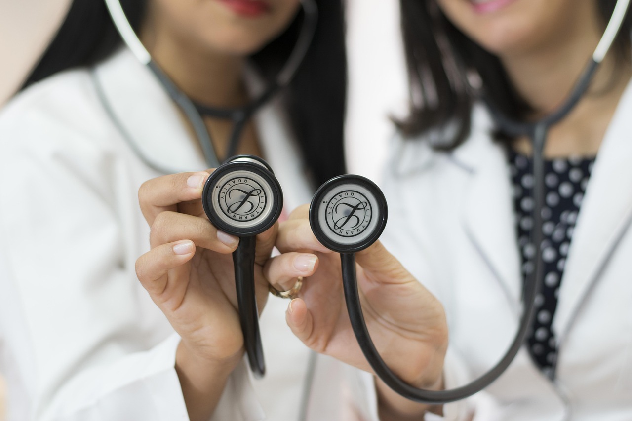 Two doctors holding stethoscopes, showcasing healthcare services.