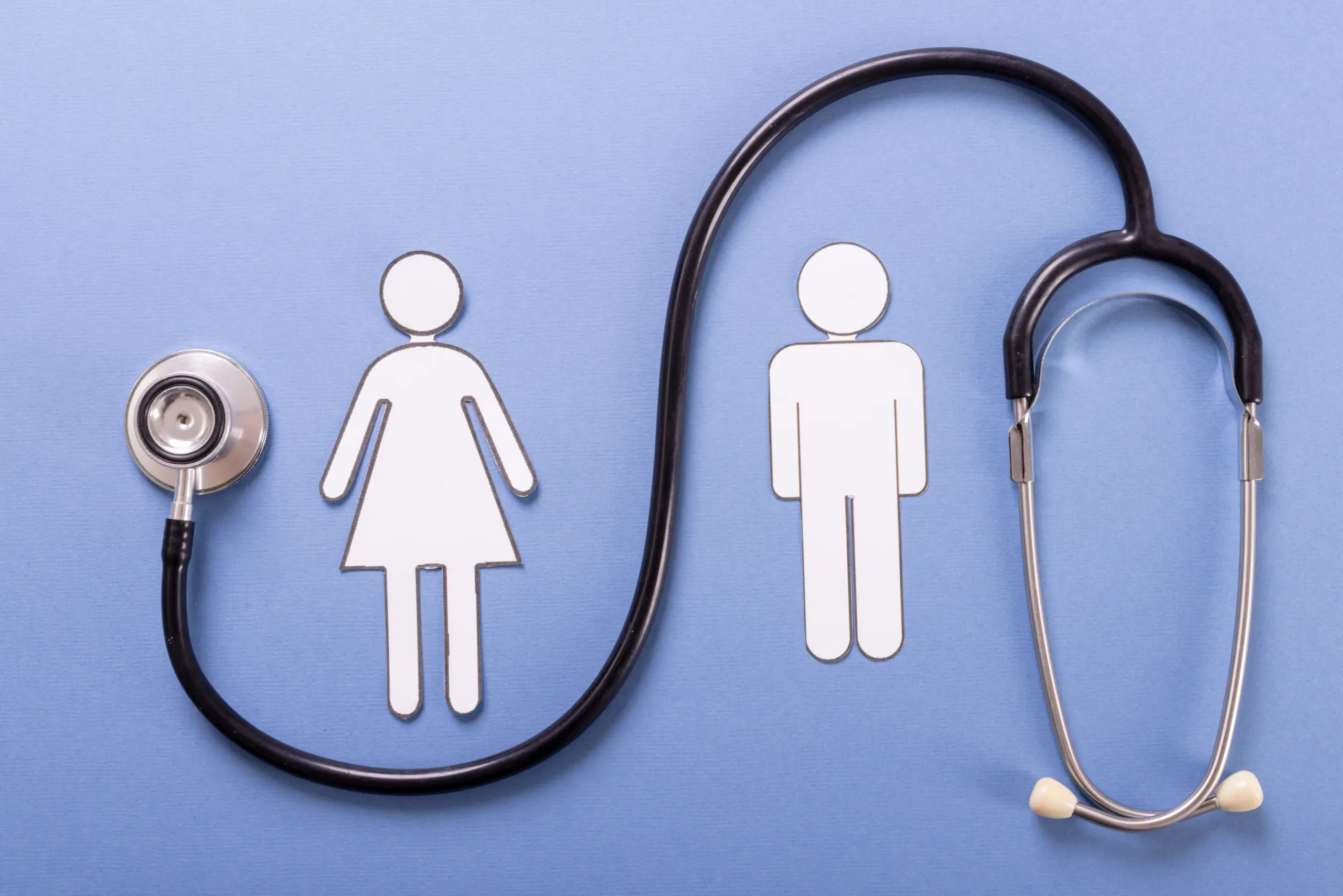 Stethoscope forming an ECG line between male and female symbols