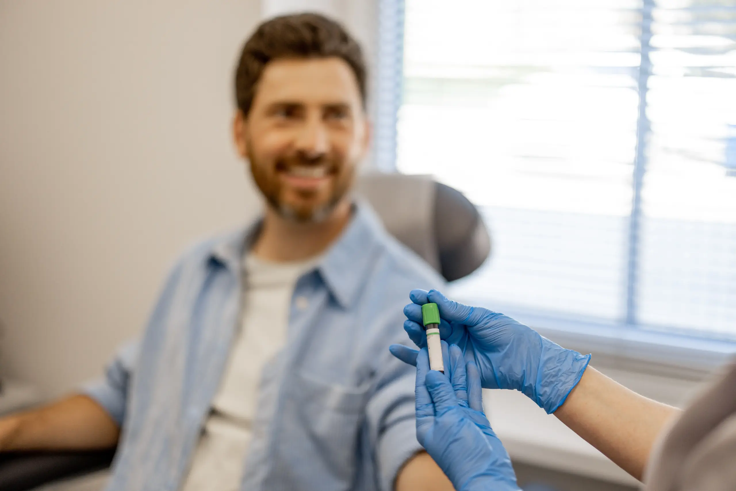 Patient giving a blood sample in a laboratory for an eGFR kidney test