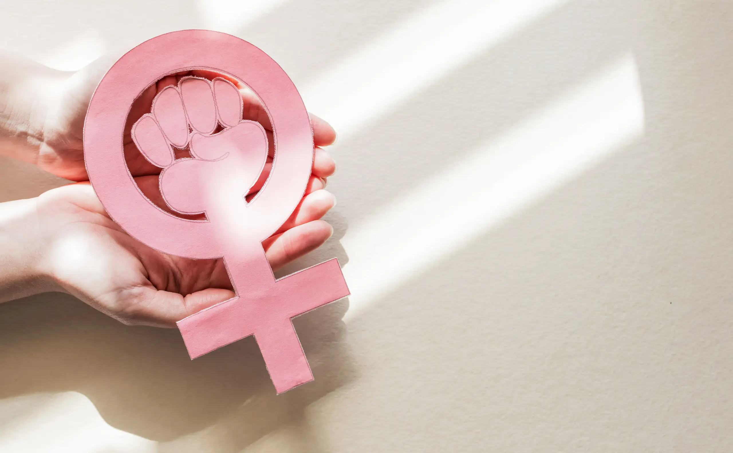 Hands holding a womenu2019s health symbol, PCOS fibroids and endometriosis